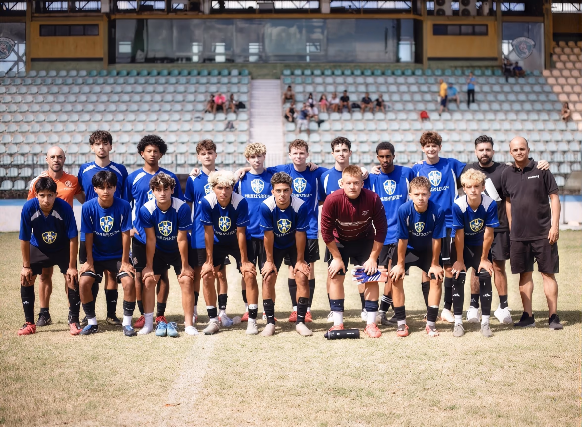 Team photo of a camp group with coaching staff